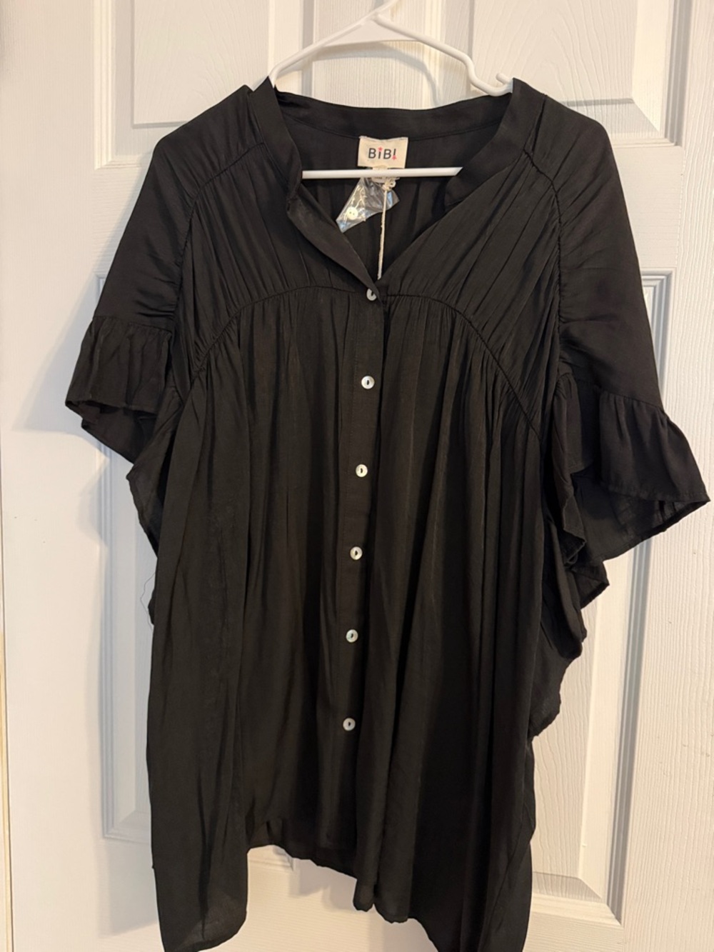 BiBi Black Button-Front Ruffle Sleeve Blouse- soft and flowy